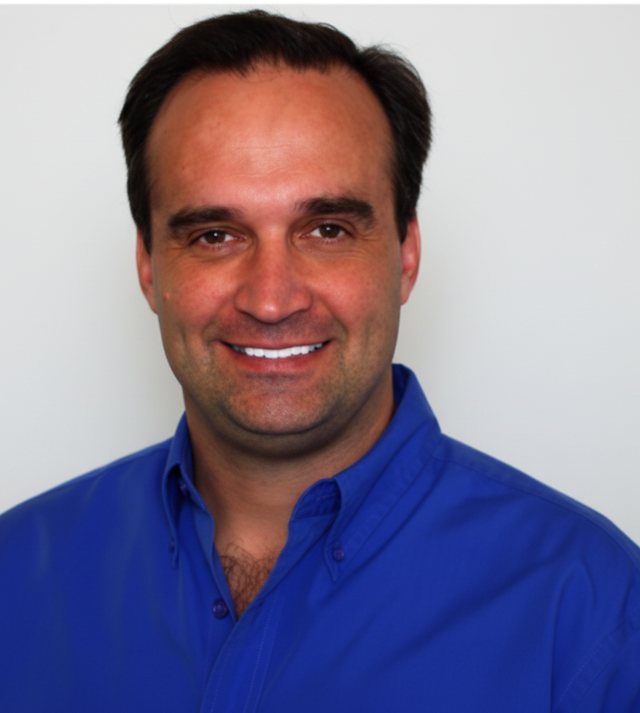 Dan Stolts, smiling, in a blue shirt